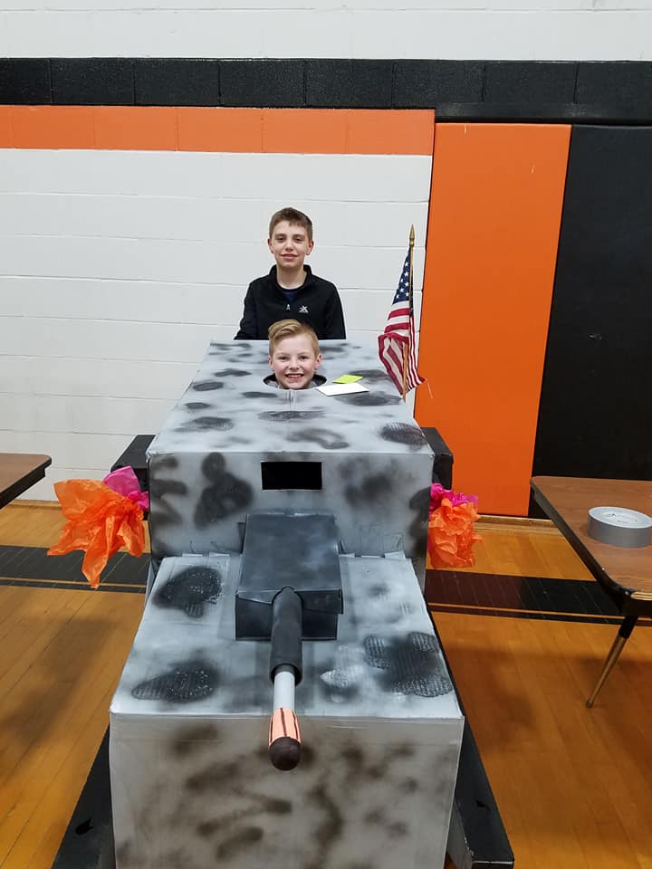 boy inside a tank made of recycled material